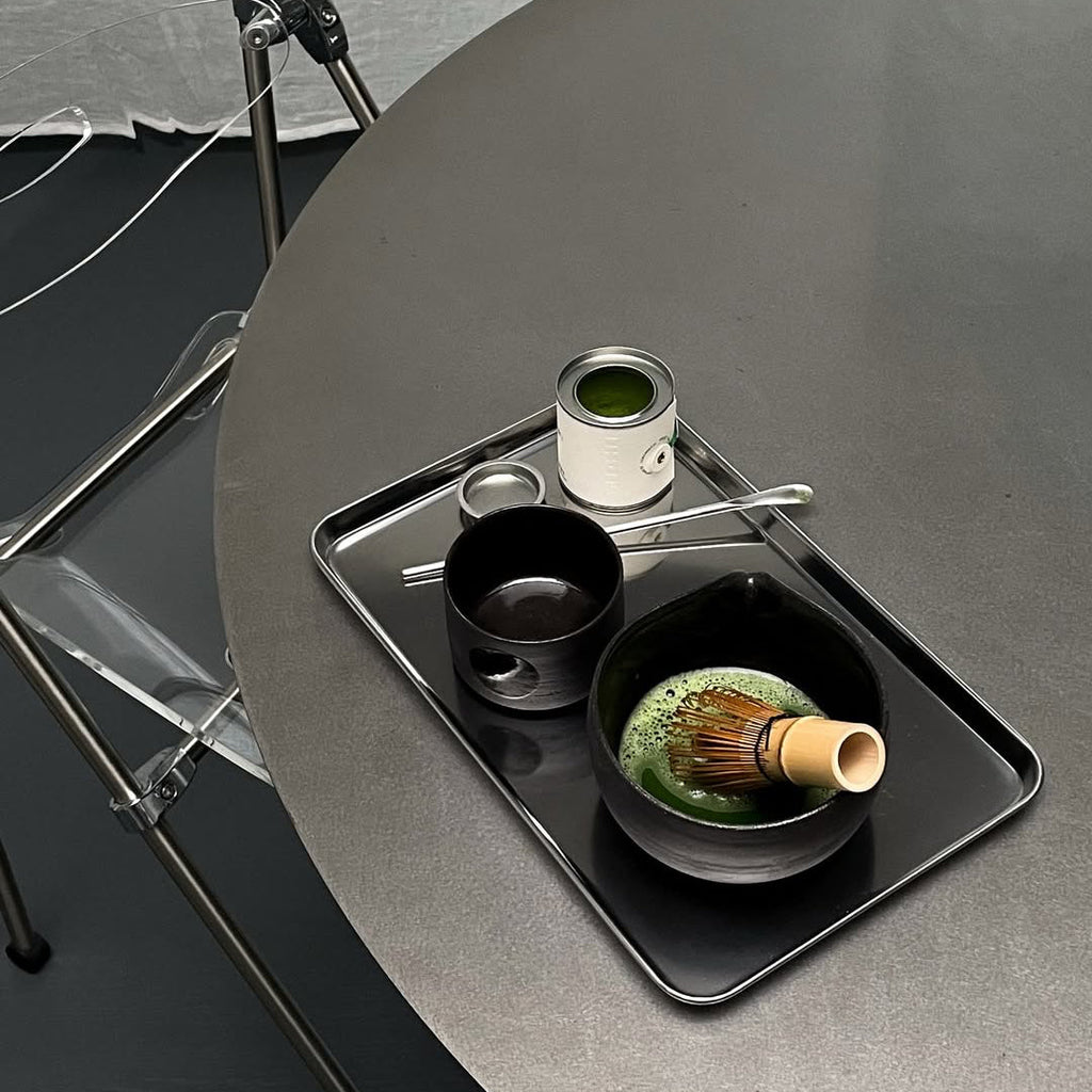 Rectangular stainless steel serving tray with raised edge