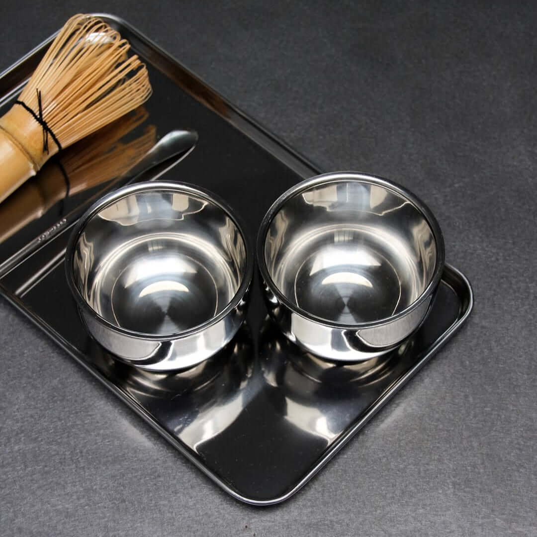 Rectangular stainless steel serving tray with raised edge