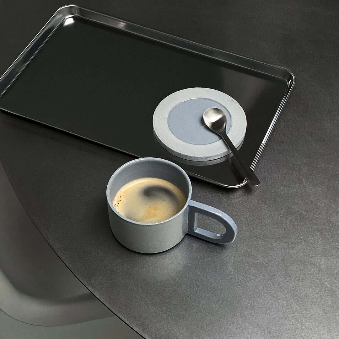 Rectangular stainless steel serving tray with raised edge