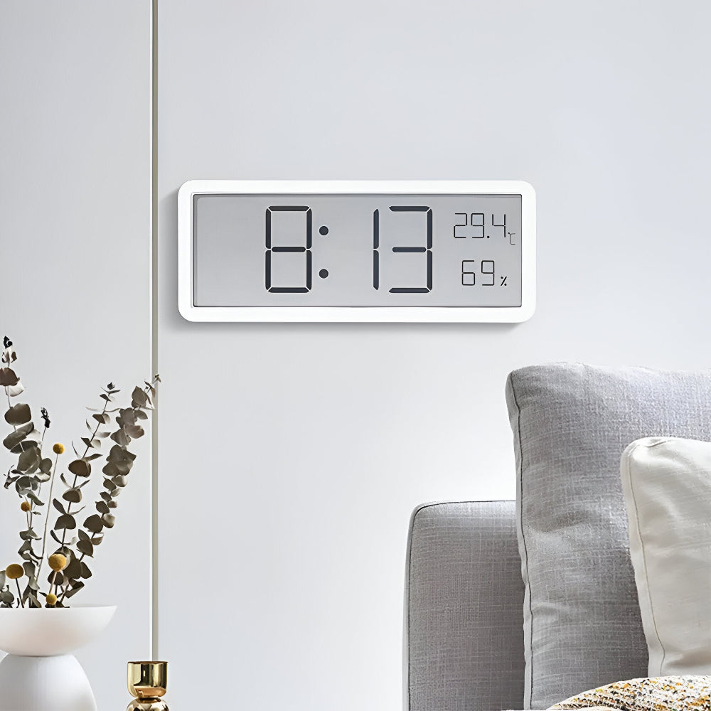 Rectangular digital wall clock displaying time, temperature and humidity