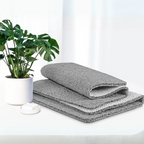 Textured non-slip bathroom mat beside a shower