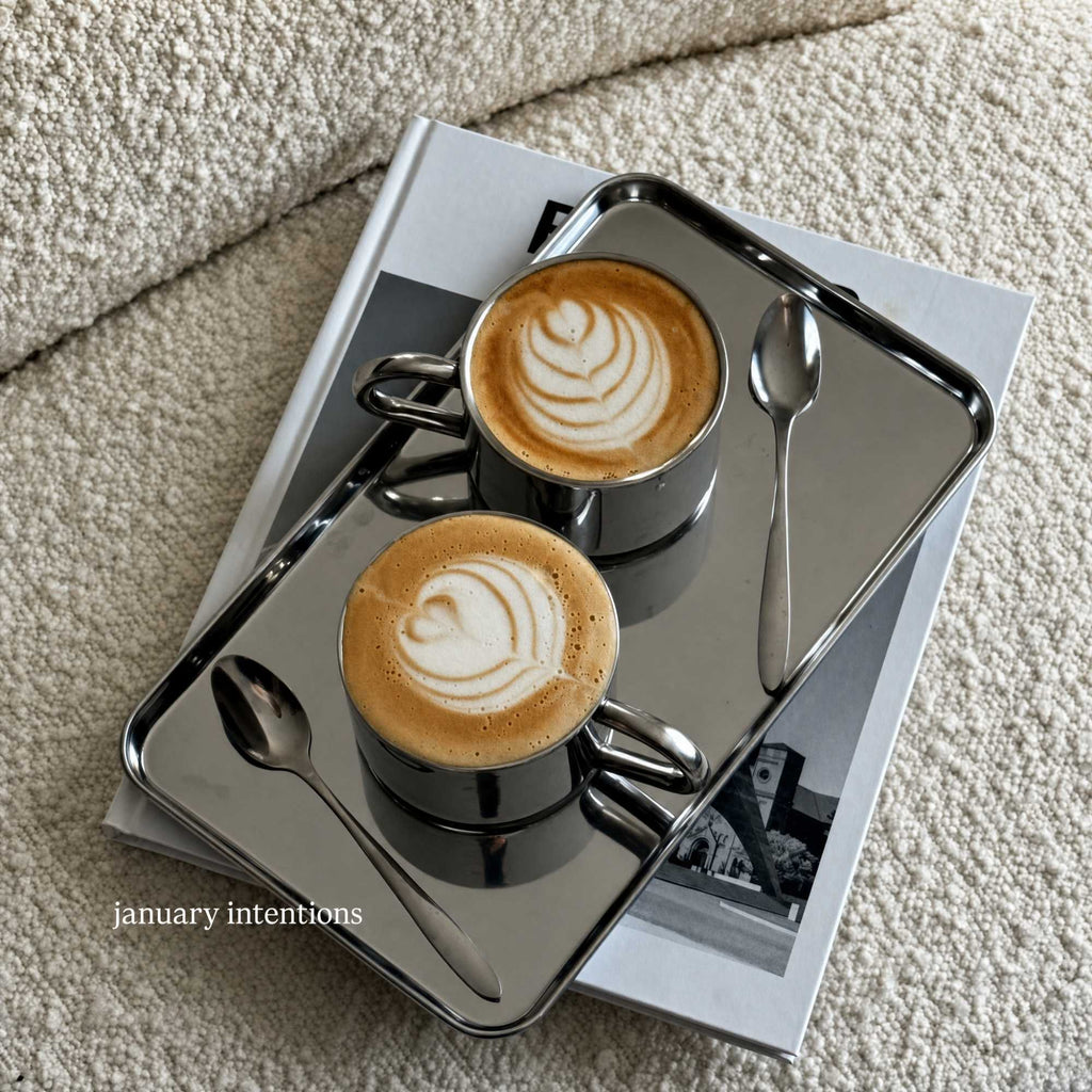 Rectangular stainless steel serving tray with raised edge