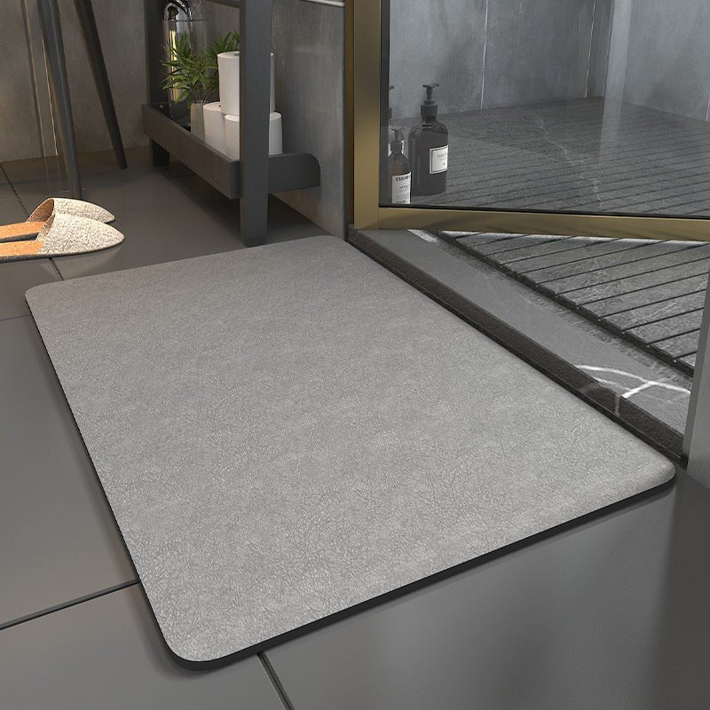Plain rectangular bathroom floor mat with rounded corners and dark edging