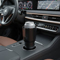 Portable heated and cooled drink holder positioned in a vehicle cup holder