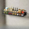 Black wall-mounted kitchen storage shelf with towel holder and hooks