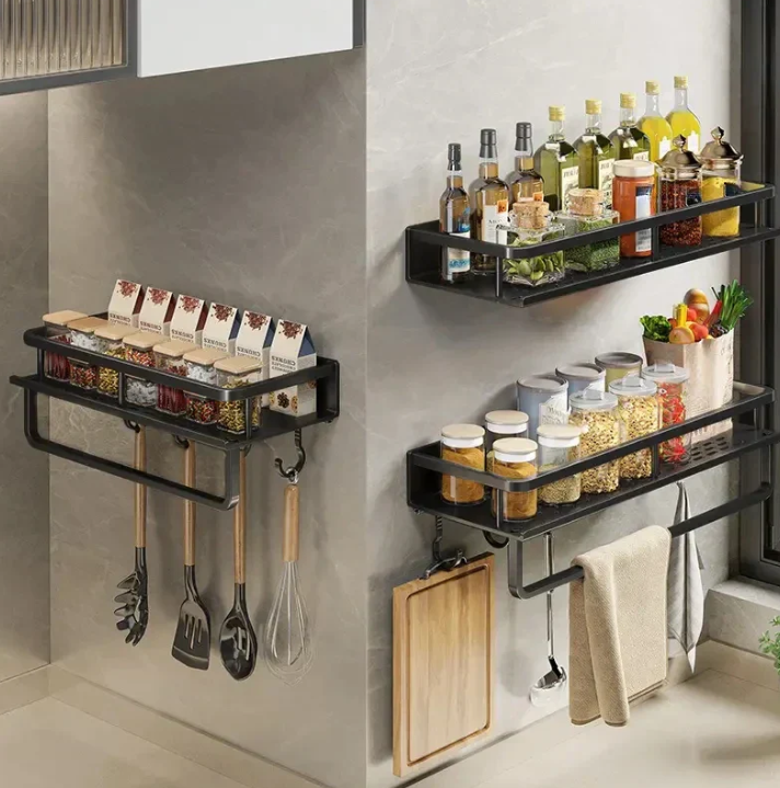 Black wall-mounted kitchen storage shelf with towel holder and hooks