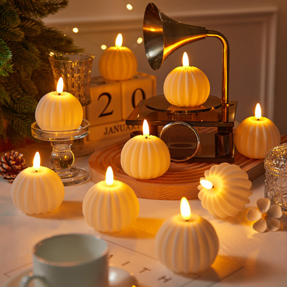 LED flameless candles with flickering flame-shaped lights in pillar and pumpkin-inspired designs