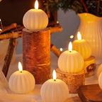 LED flameless candles with flickering flame-shaped lights in pillar and pumpkin-inspired designs