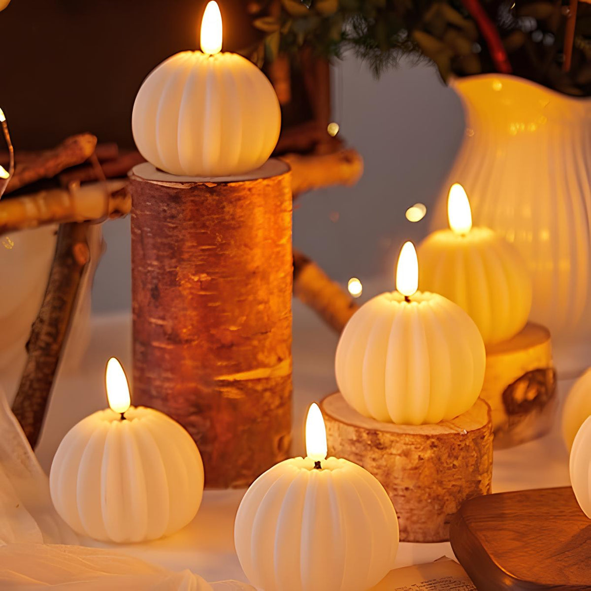 LED flameless candles with flickering flame-shaped lights in pillar and pumpkin-inspired designs