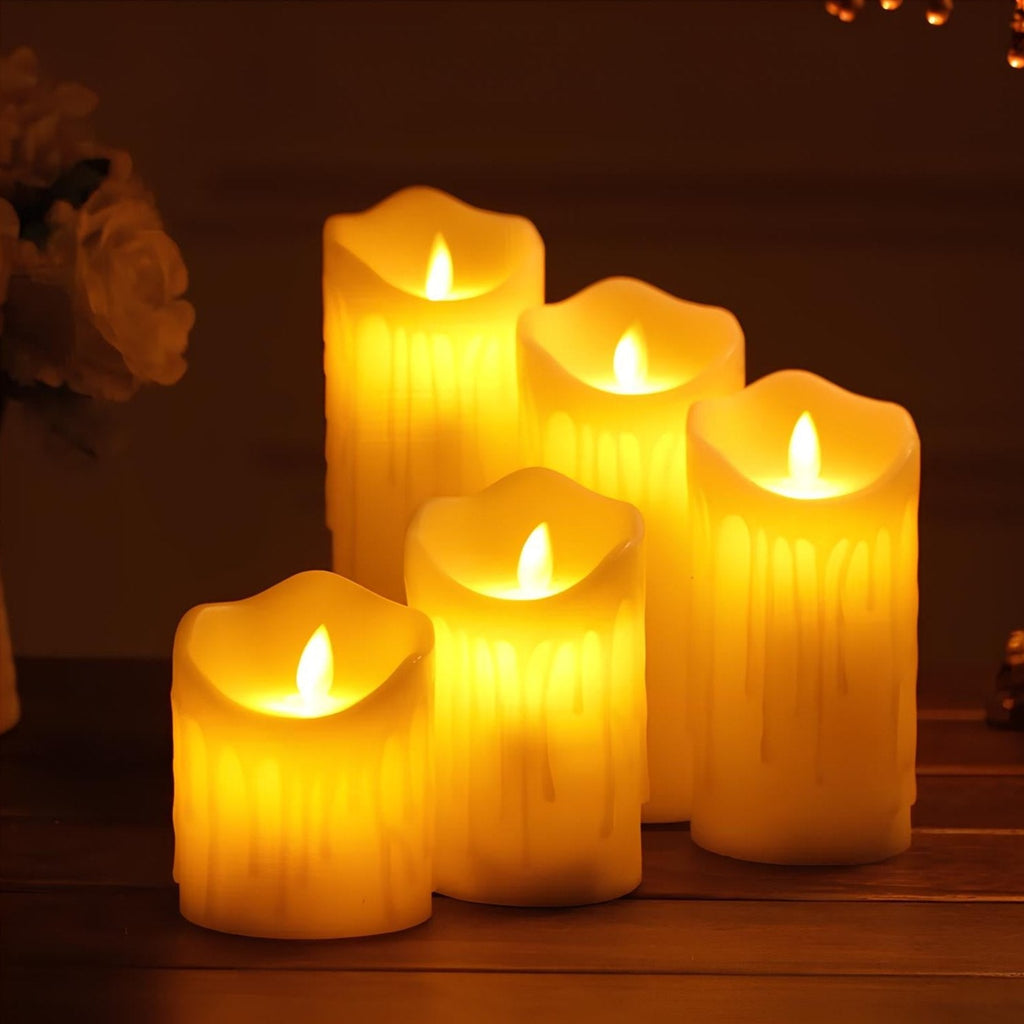 LED flameless candles with flickering flame-shaped lights in pillar and pumpkin-inspired designs