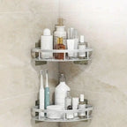 Two-tier corner shower shelf in black and silver with adhesive wall mounts