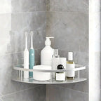 Two-tier corner shower shelf in black and silver with adhesive wall mounts