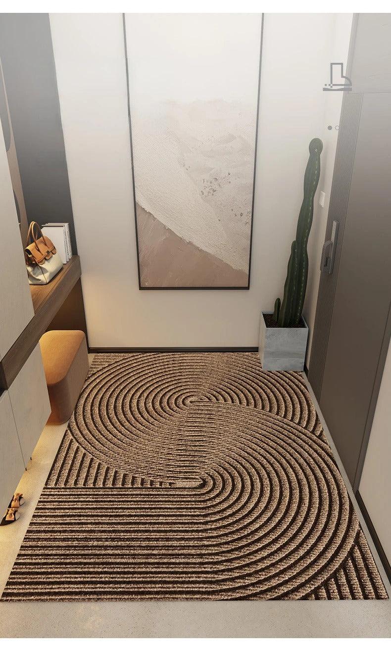 Rectangular ribbed geometric door mat positioned in a home entrance