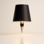 Decorative table lamp with conical shade and pointed base