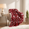 Red Christmas fleece throw blanket with white snowflakes and Merry Christmas lettering