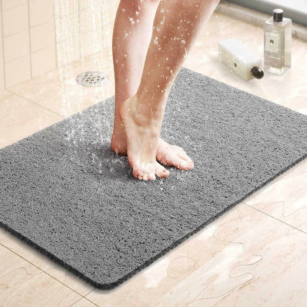 Textured non-slip bathroom mat beside a shower