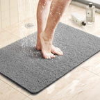 Textured non-slip bathroom mat beside a shower