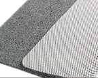 Textured non-slip bathroom mat beside a shower