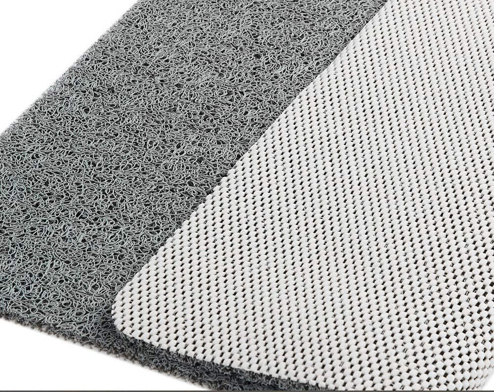 Textured non-slip bathroom mat beside a shower