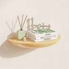 Half-round floating wall shelf with a wood grain finish