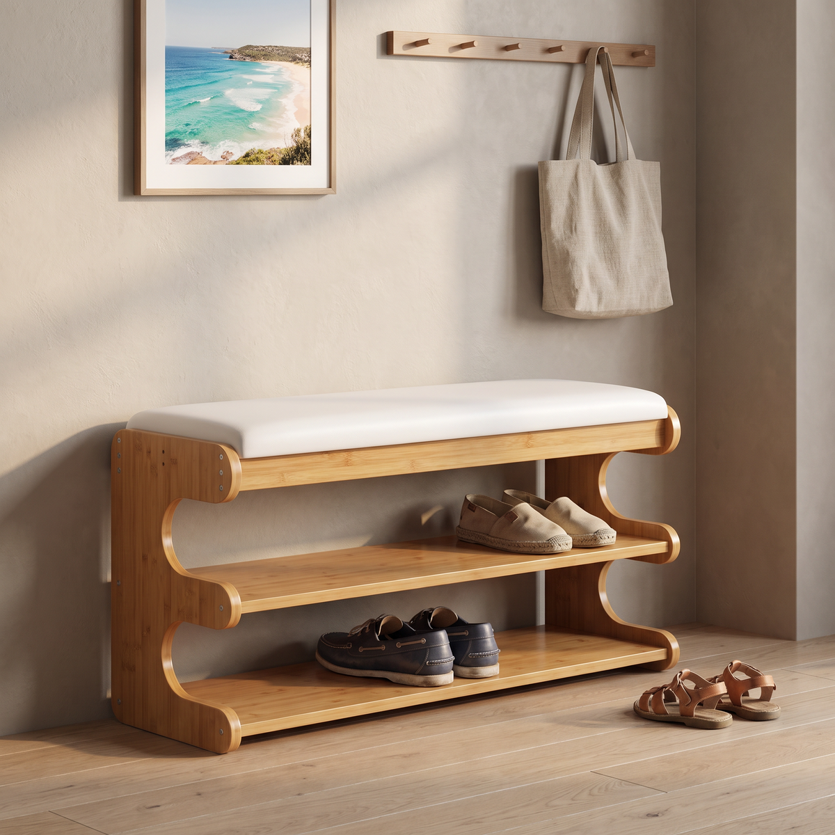 Brown bamboo shoe bench with white padded seat and two open storage shelves