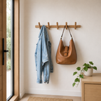 Brown oak-effect wall-mounted coat rack with multiple rounded pegs