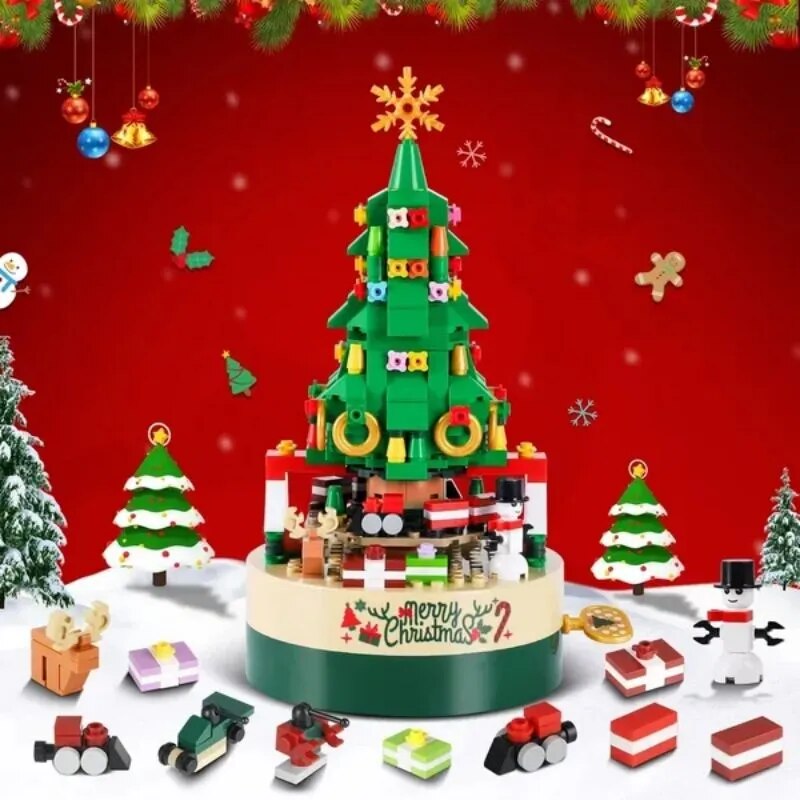 Green Christmas tree music box with hand crank, train scene and festive decorations