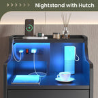 Black LED bedside table with three drawers, illuminated shelf and built-in power panel