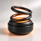 Portable heater with a glowing spiral coil and rounded base