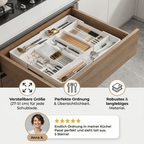 White compartmented cutlery organiser arranged inside a kitchen drawer