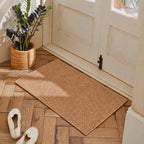 Rectangular textured pile door mat with bound edges